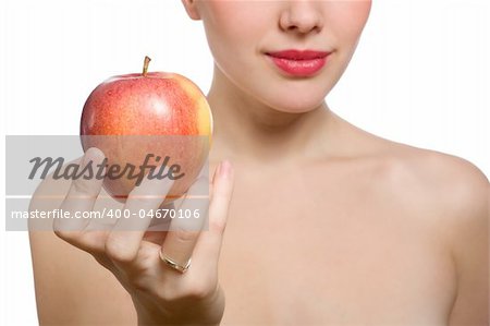 young blonde woman offering red apple, shallow DOF, Focus on the apple