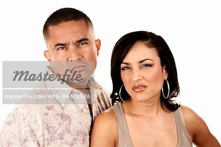 Attractine Hispanic Couple on White Background Showing Disgust or Anger