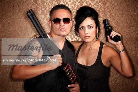 Attractive male and female undercover cops with firearms