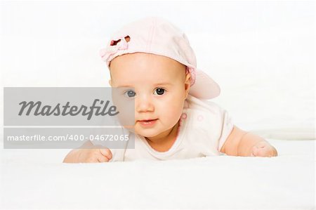 Portrait baby girl wearing pink hat