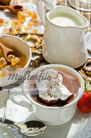 Hot chocolate served with milk and sugar
