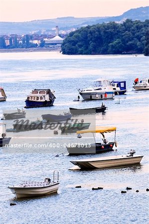 Many small fishing boats anchored on Danube river. View from Zemun part of Belgrade.