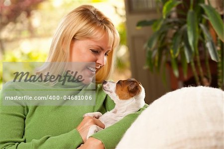 Woman and Jack Russell Terrier Puppy Enjoying a Day on The Sofa.