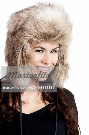 Adorable young woman with a beautiful smile and wearing a hat