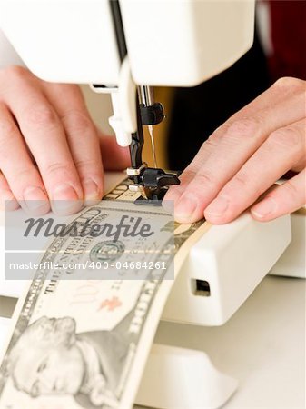 Ten dollar bank notes in a sewing machine