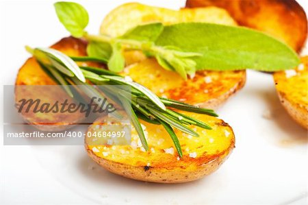 fried potato with a rosemary leaf