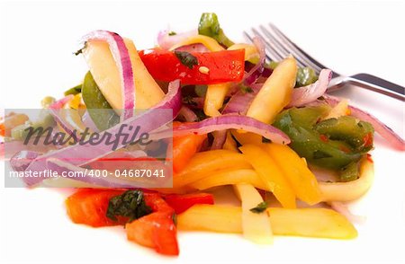 Tangy mango salad made with slices of mangoes, red peppers, onions, green peppers and an assortment of spices.