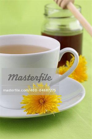 Healthy herbal tea made from freshly picked dandelions with honey