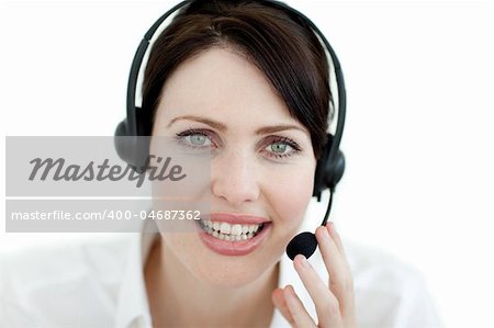 Close-up of an attractive businesswoman with headset on against a white background