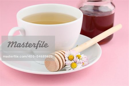 Healthy herbal tea made from freshly picked daisies with honey