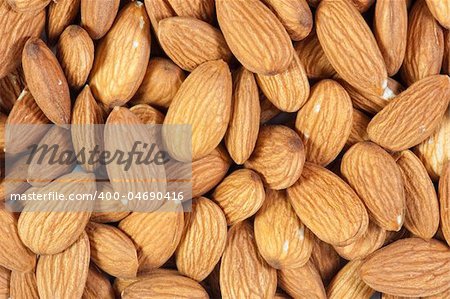 Peeled Almond as background . Close - up.