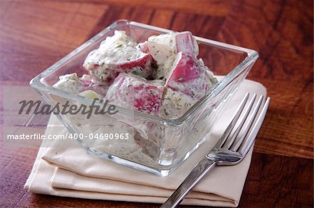 Delicious white pommery potato salad dressed in mayo infused with parsley and select spices.