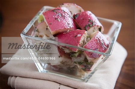 Red Potato Salad dressed in a tangy dressing of celery, peppers, herbs and onions.