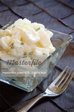 Delicious creamy potato salad dressed in mayo infused with parsley.