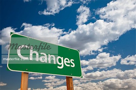 Changes Green Road Sign with Copy Room Over The Dramatic Clouds and Sky.