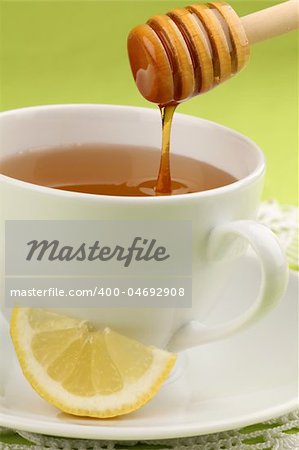 Healthy tea with honey and slice of lemon