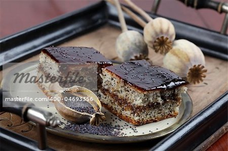 Delicious poppy seed sponge cake with plum jam