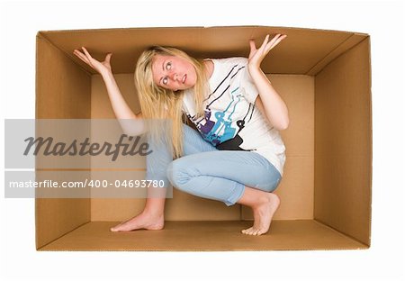 Young Woman inside a Cardboard Box isolated on white Backgreound