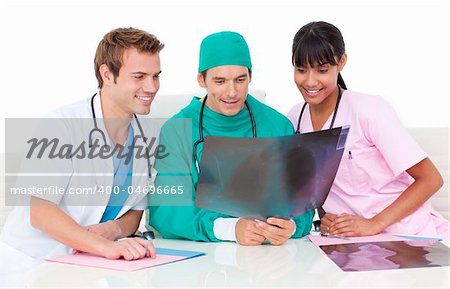 Positive male doctors looking at X-Ray in hospital