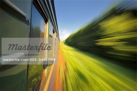 Fast riding a train passenger with motion blur