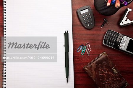 modern red business desk with various office stationery