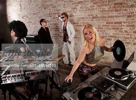 Female DJs dancing and playing music at a party