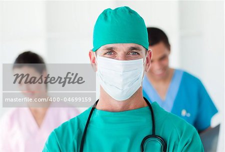 Portrait of a surgeon wearing a surgical mask in a hospital