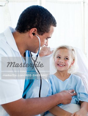 Attractive doctor checking the pulse on a young patient in a hospital