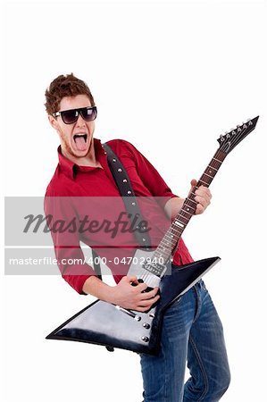 young musician screaming and sticking his tongue out while playing an electric guitar