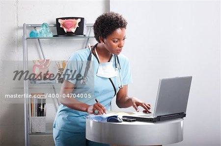 Cute afro-american doctor at her office