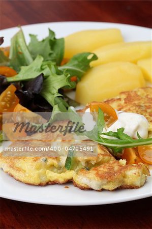 Zucchini omelet with eggs and blue cheese. Shallow DOF