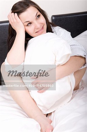 young adult woman in bed