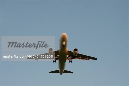 Plane landing with lights on