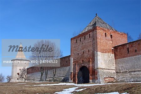 The wall and towers of big castle of red brick
