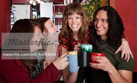 Four chummy friends hanging out at a bistro