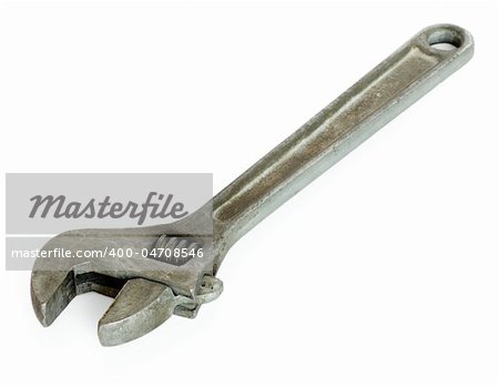 Old adjustable spanner isolated on white background