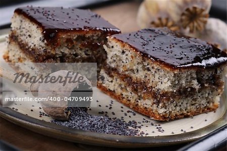 Delicious poppy seed sponge cake with plum jam