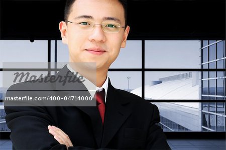 Handsome asian business man in suit at an airport