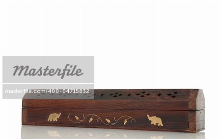 Incense wood box with indian motifs isolated on white background.