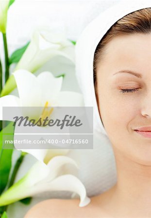 Resting woman lying on a massage table in a spa center