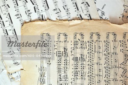 Old music sheet pages - art background. Ancient note sheets