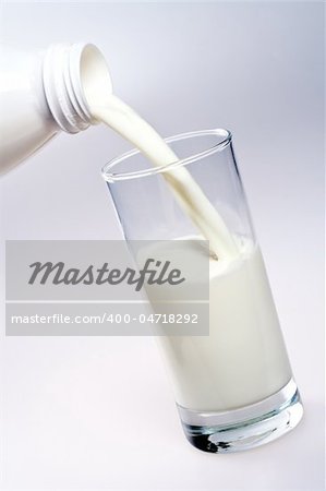 glass of milk with a bottle
