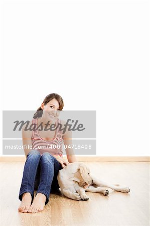 Young woman holding a beautiful and cute dog