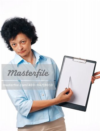 Serious elder woman holding a clipboard and showing something over white.