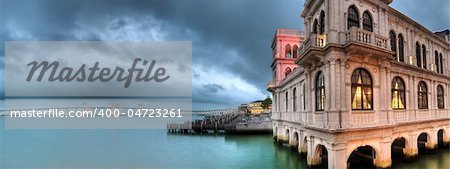 Cityscape of building on dock with beautiful bridge and ocean in Macao, China.