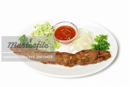 minced mutton chop with sauce and vegetables at dish