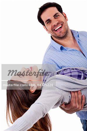 young man holding lady in his arms