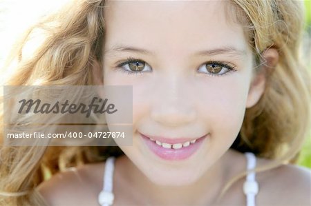 beautiful little girl portrait smiling closeup face looking camera