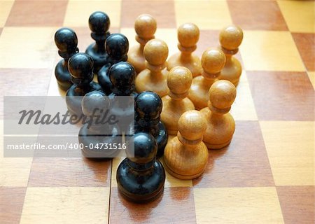 Vintage black and white pawns on chess boardVintage black and white pawns on chess board