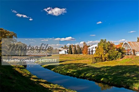 The river flows near to old factory